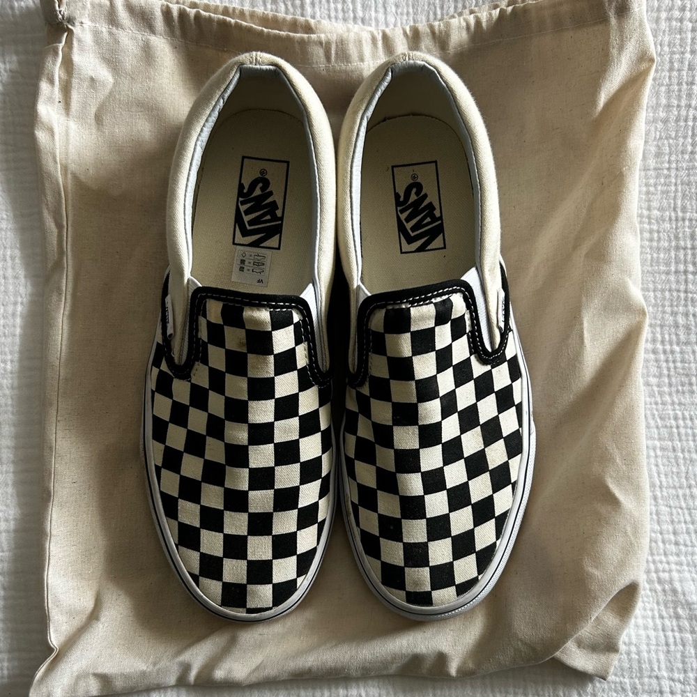 Vans Classic Slip-On Checkerboard shoes in black and white canvas